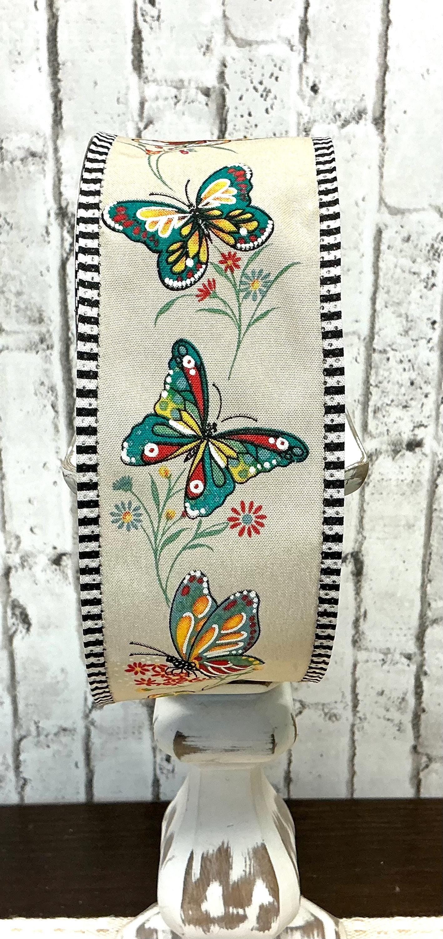 Butterfly ribbon with tan background and a black and white edge, 2.5” x 10YD, RGA882818