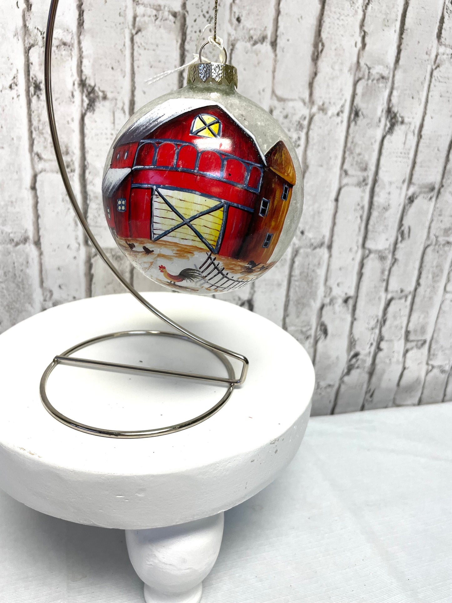 Blown glass ball with painted barn Christmas ornament