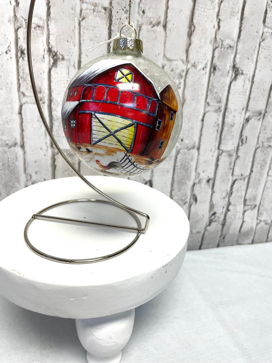 Blown glass ball with painted barn Christmas ornament